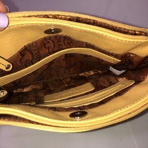 Tignanello Bags - Pale Yellow Tignanello cross body purse Tignanello Bags - Pale Yellow Tignanello cross body purse